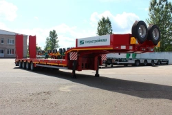 Heavy-duty Semi-Trailer TverstroyMash 993941 Modification 0023 with Hydraulic Double Folding Ramps