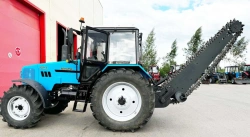 Road and Municipal Utility Machine UDKM-7 on Belarus 1221.3 Tractor with Universal Plow